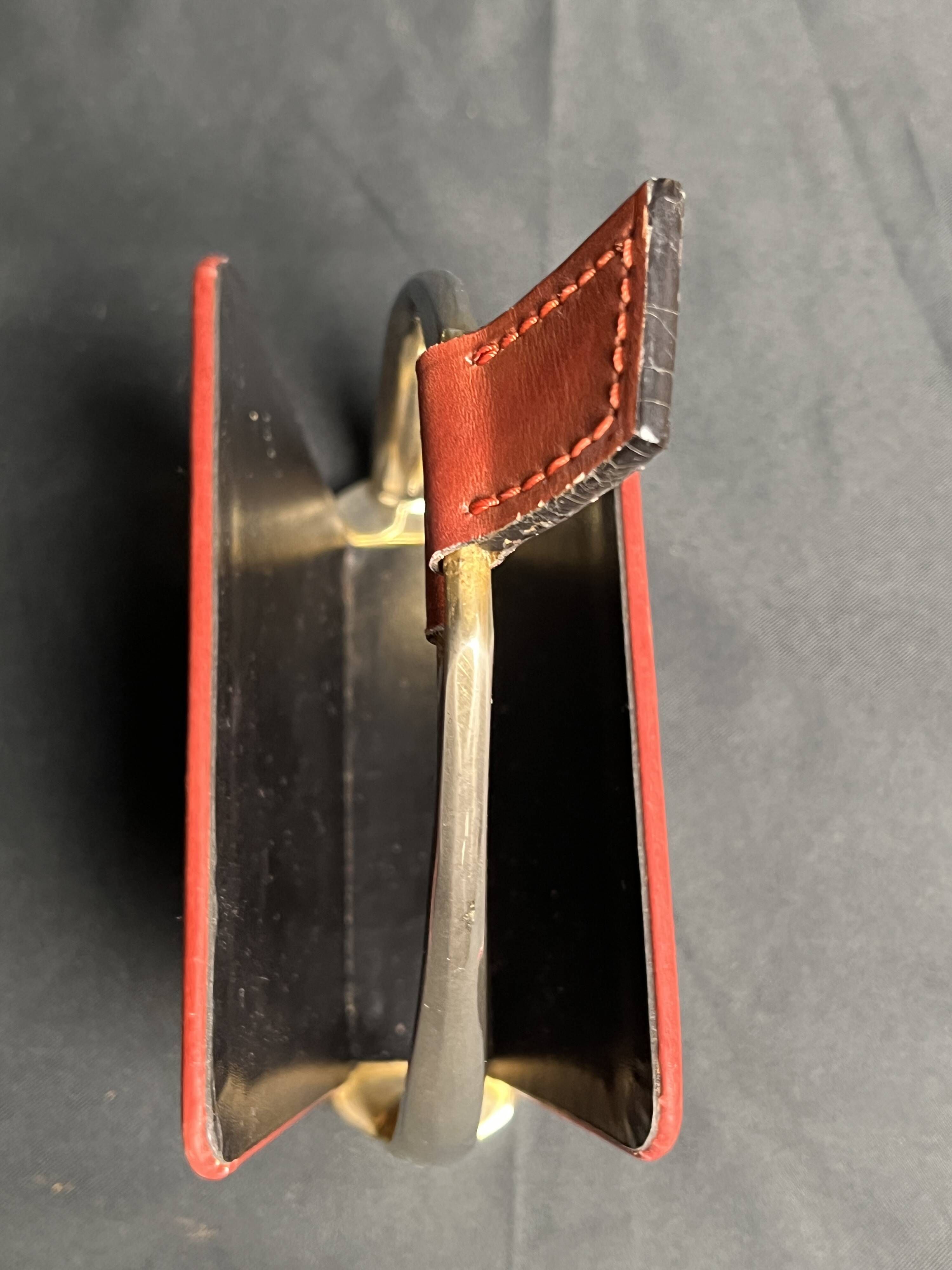 Longchamp, empty pocket document holder with leather and gold metal stirrup from around 1970.