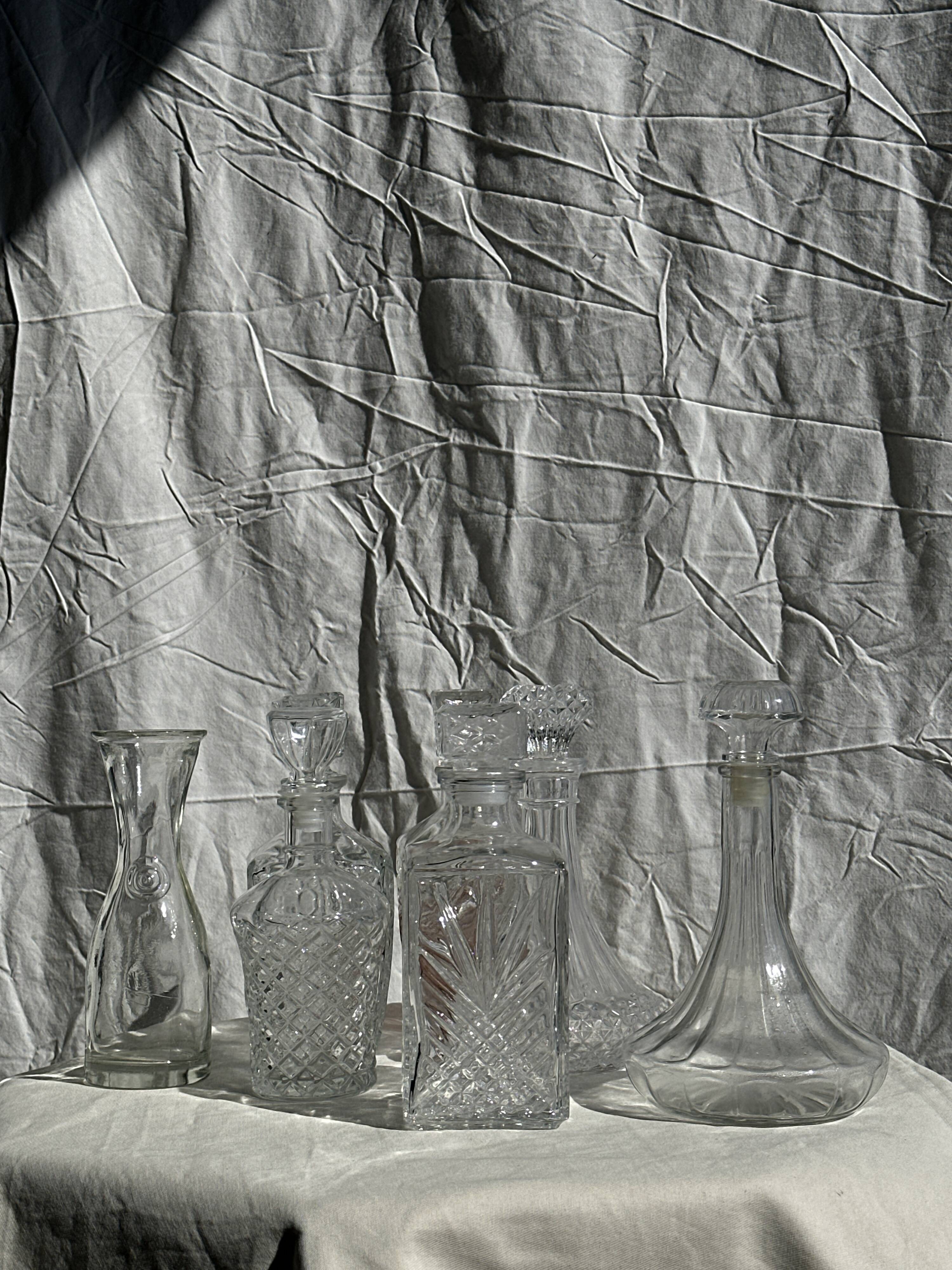 Small cylindrical glass whiskey decanter H:23