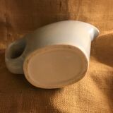 Light blue pitcher in vintage earthenware