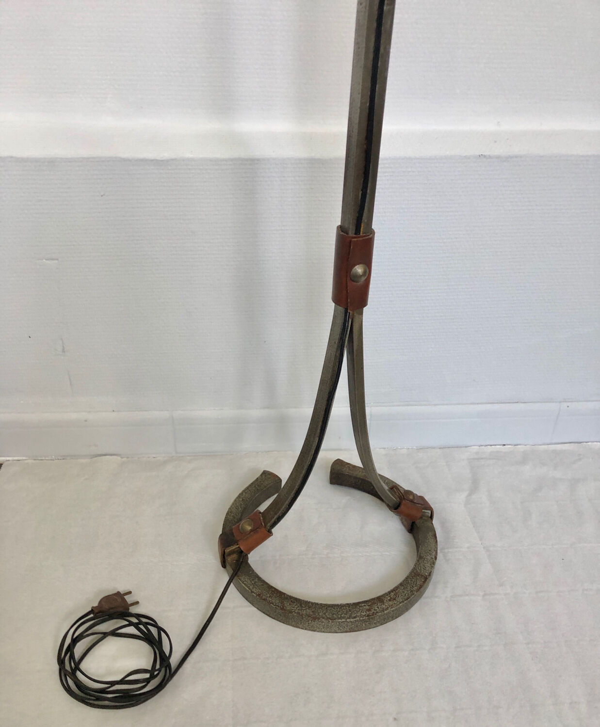 Hammered wrought iron and leather floor lamp by Jean Pierre Rickaert, 1950s