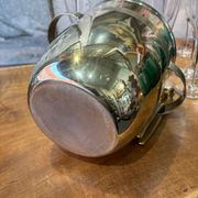 Alpaca champagne bucket from the 1920s with its monopole tongs.