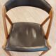 Set of 6 vintage Kai Kristiansen chairs in solid teak and black faux leather.