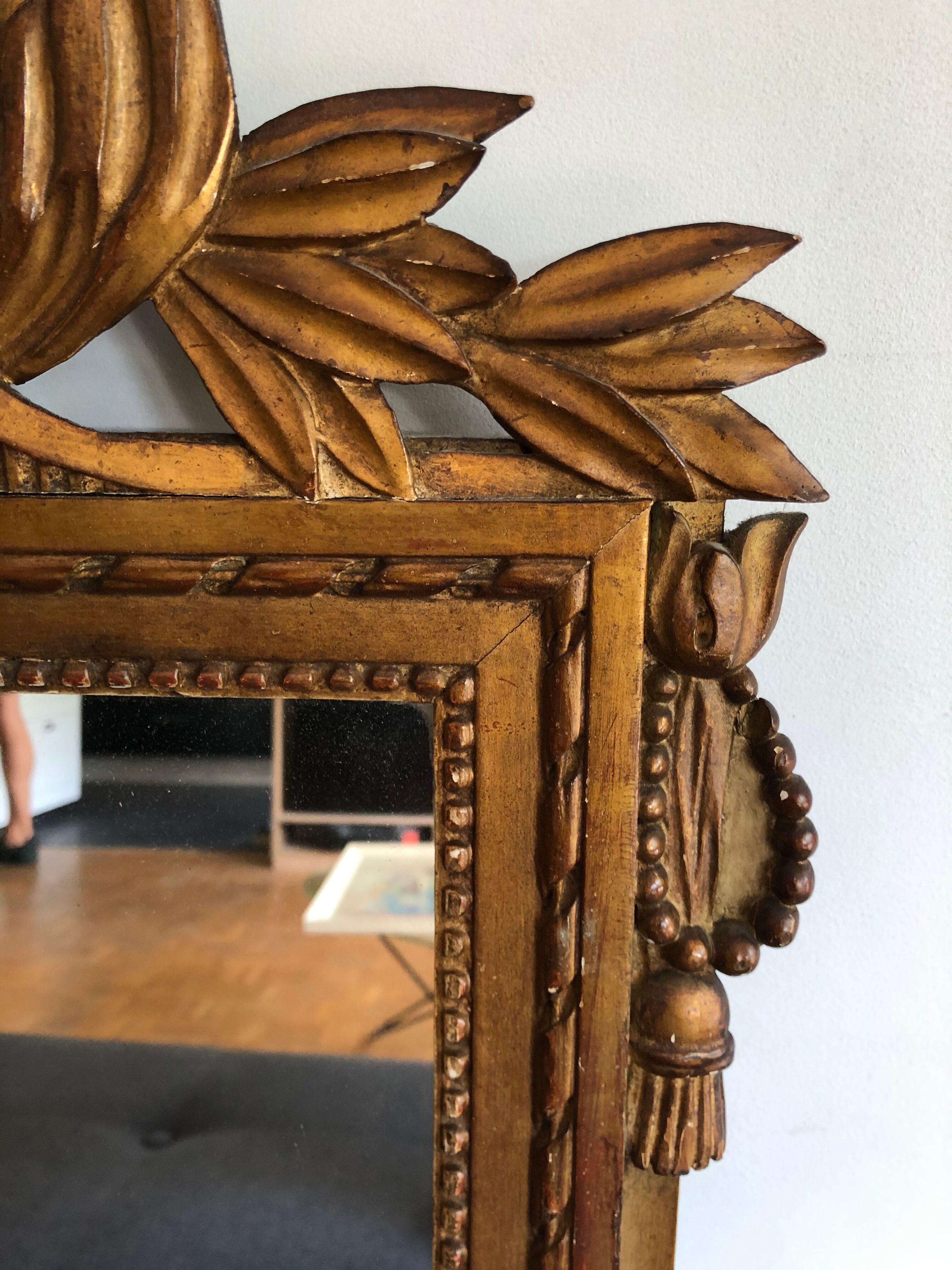 Gilded wooden pediment mirror