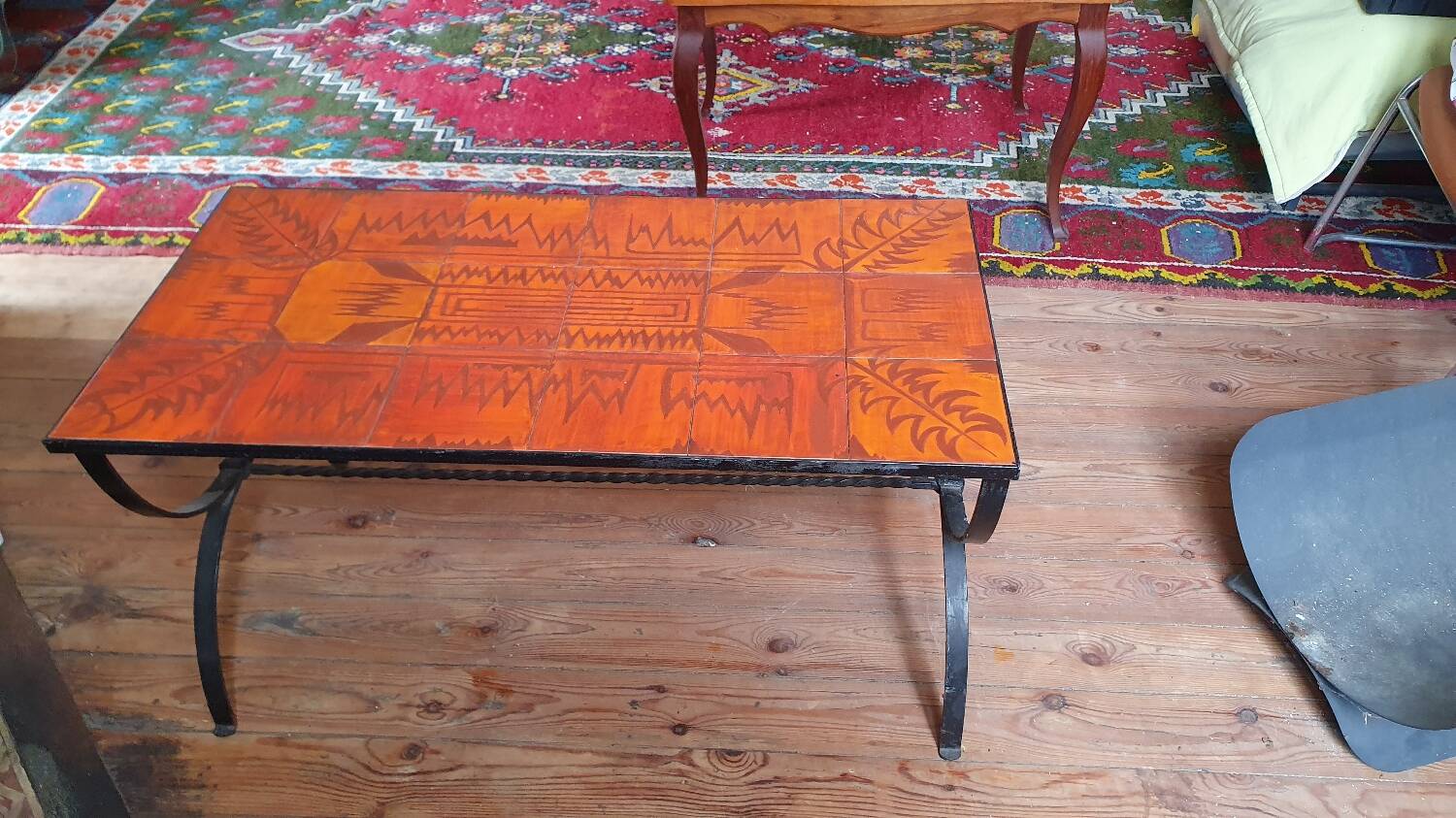 Wrought iron and orange ceramic coffee table