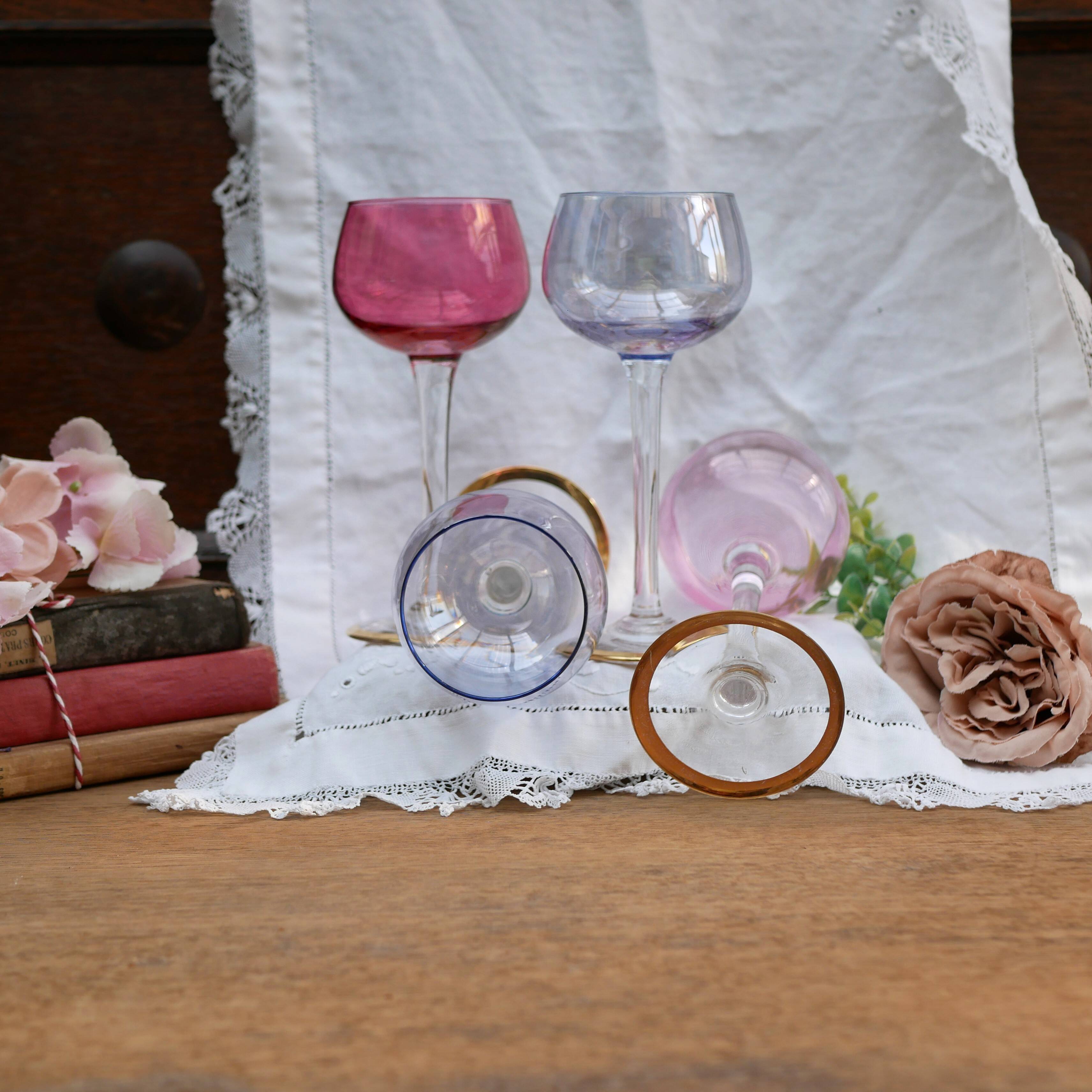 Four colorful stemmed wine glasses