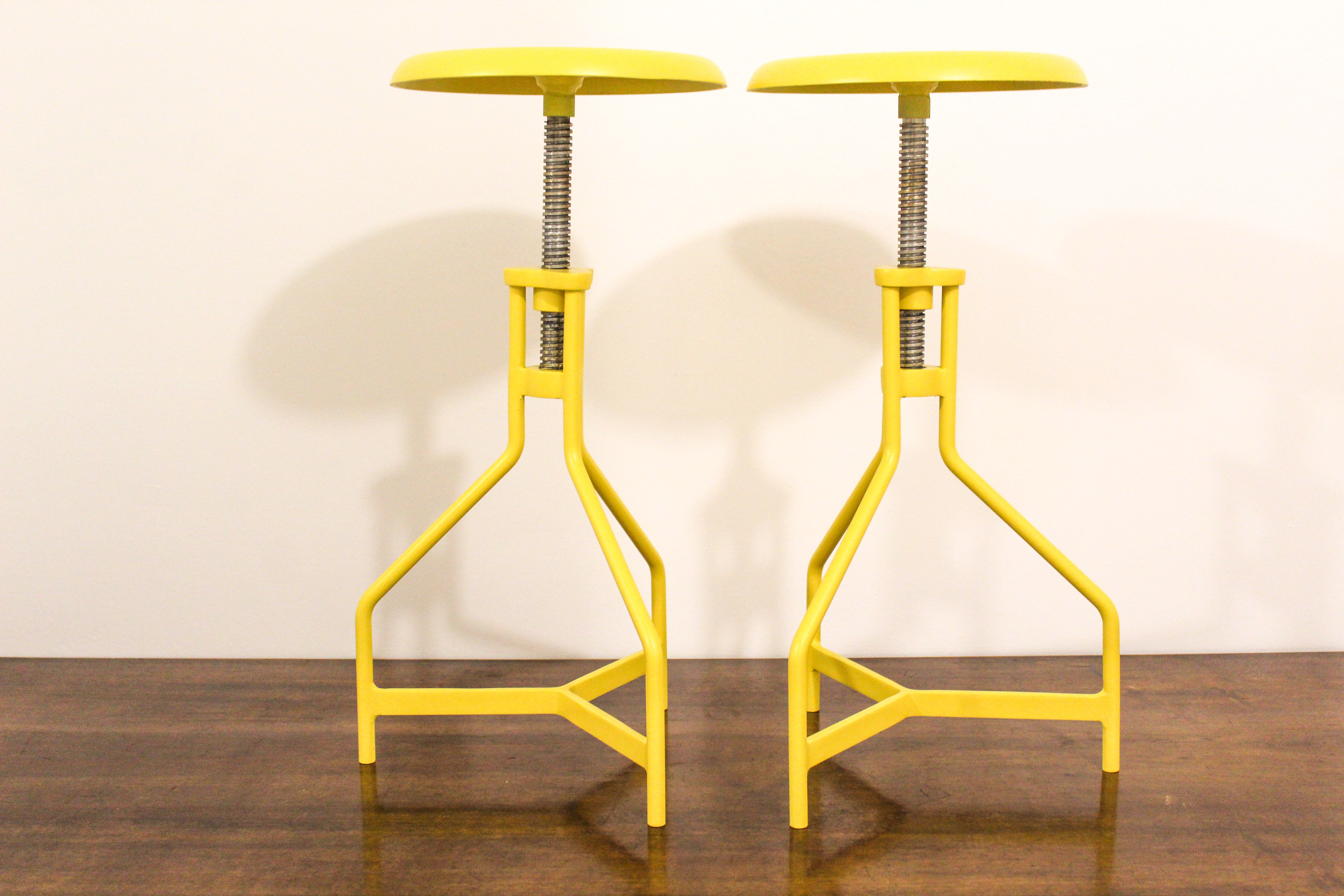 Pair of yellow lacquered metal stools, Restaurati, Italy 70's
