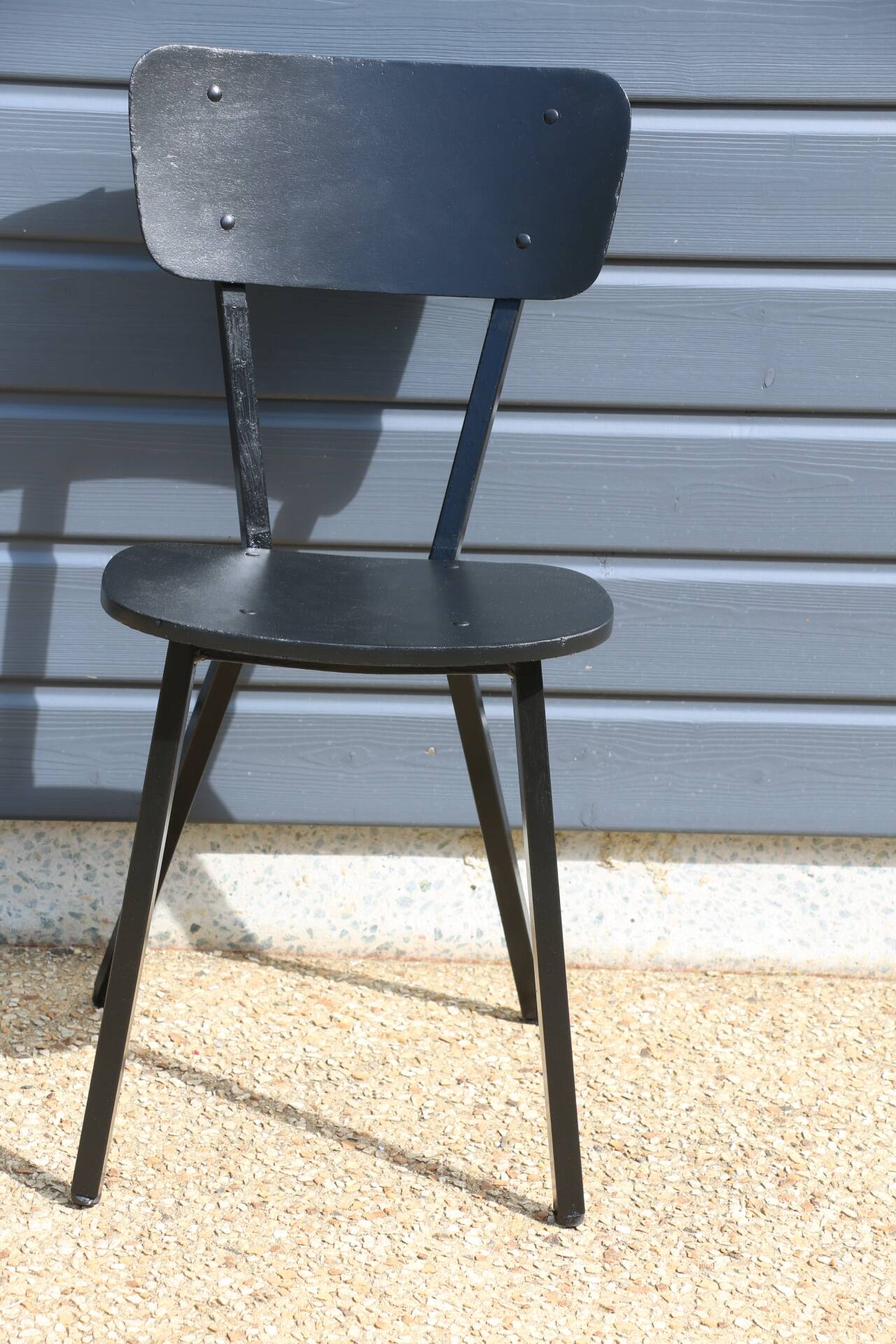 4 black metal and wood chairs