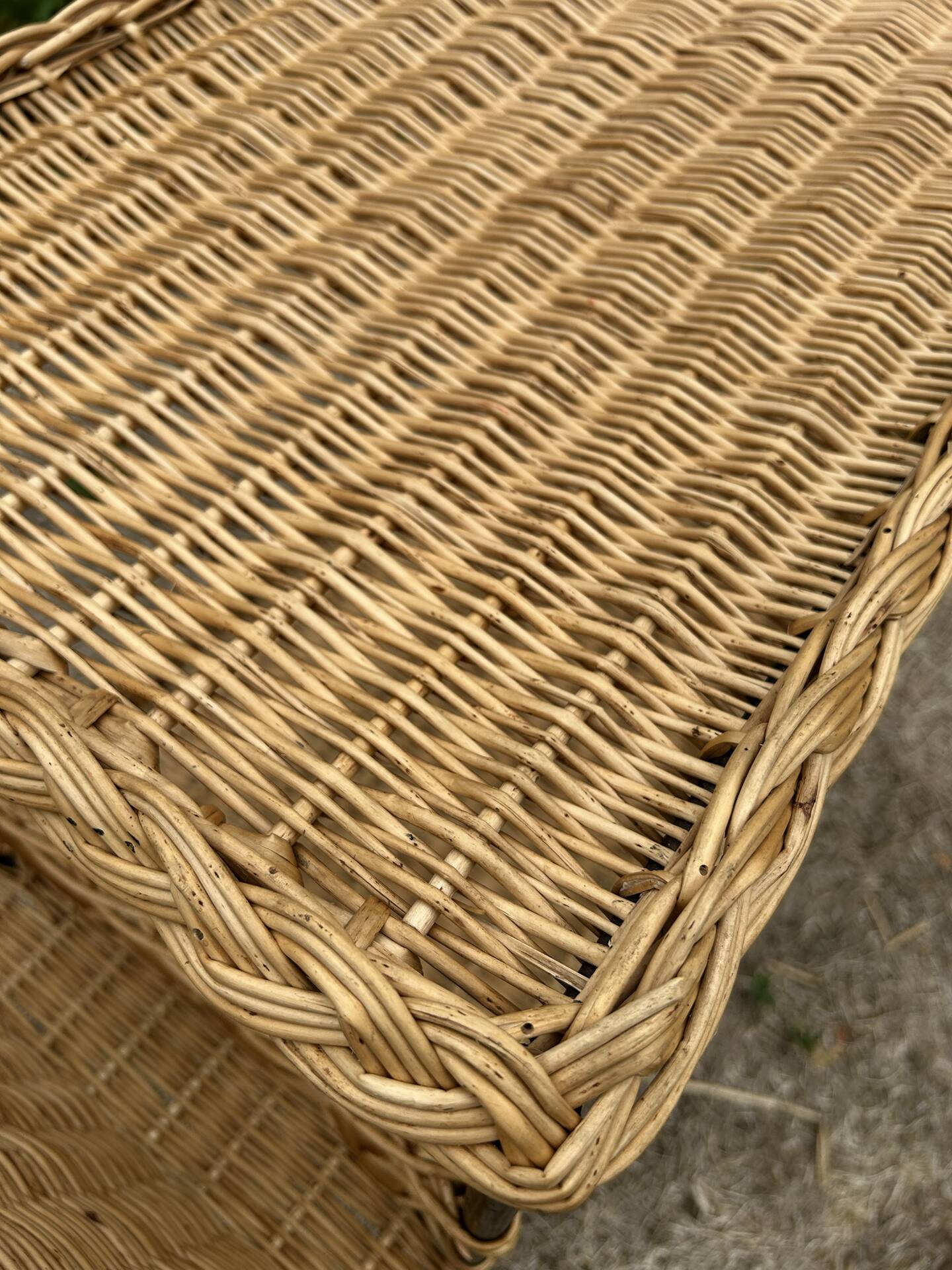 Vintage 1950s rolling dessert trolley in wicker and black tubing.