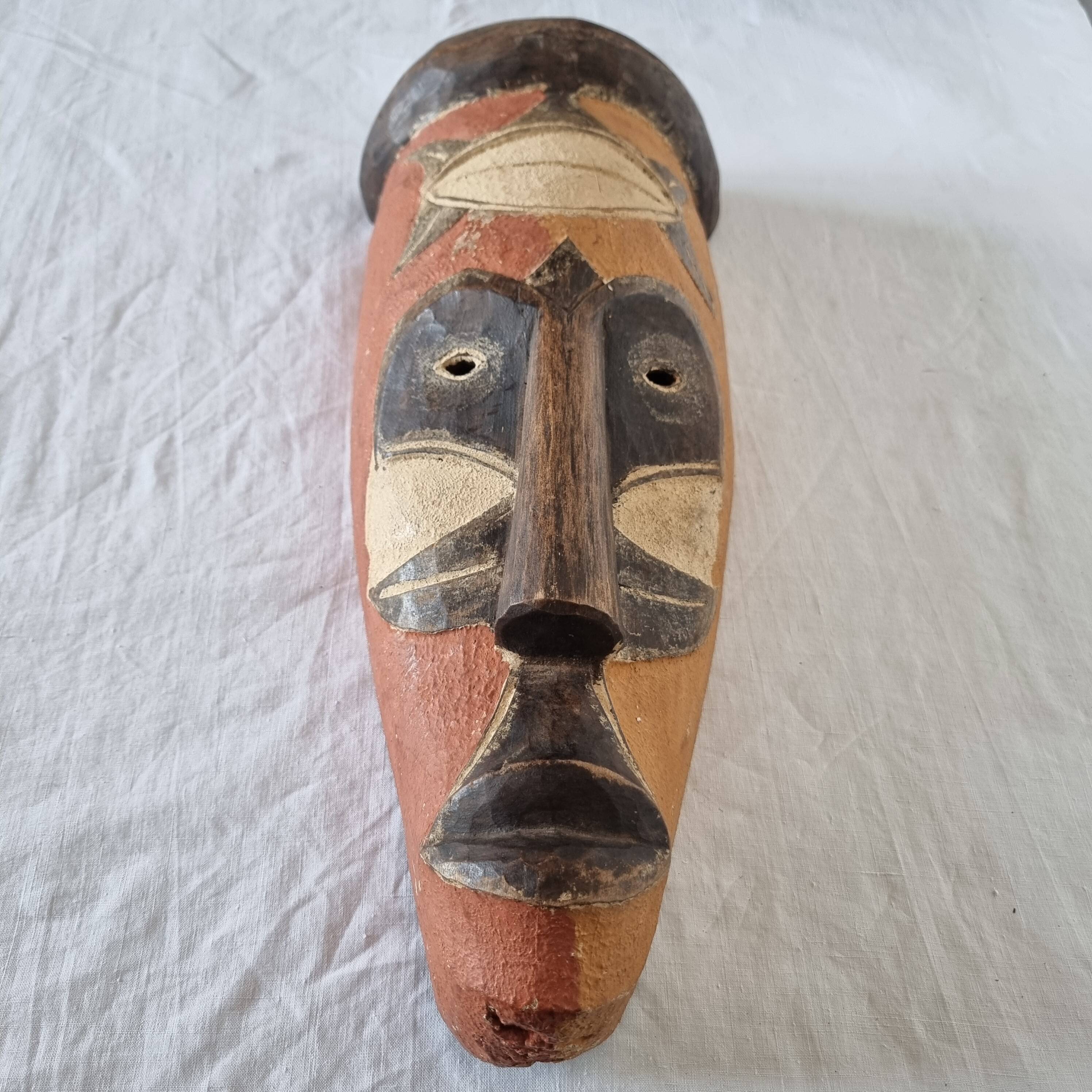 Wooden mask baule carved and hand painted with natural pigments from ivory coast