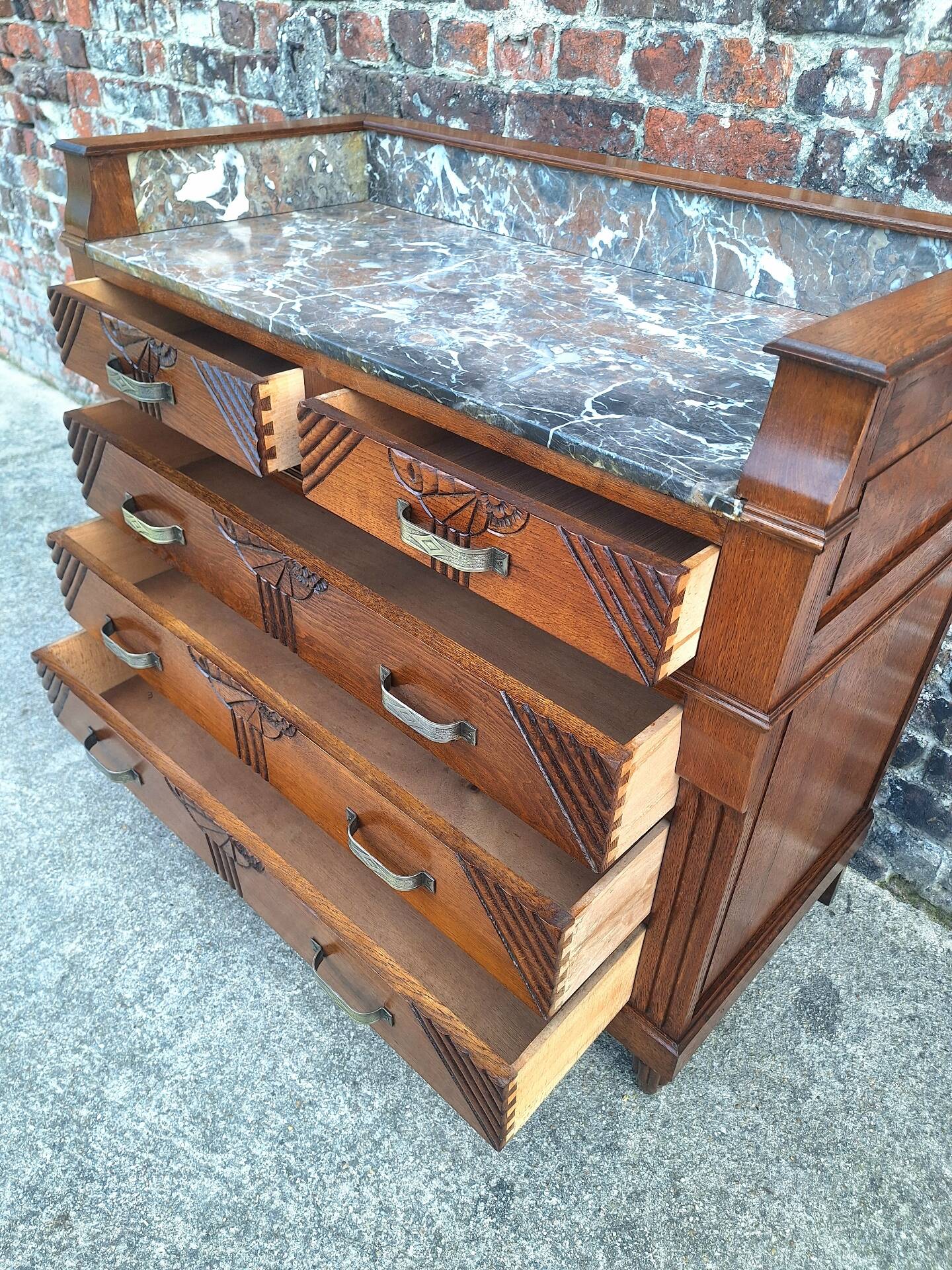 Art Deco commode with marble top, vintage antique furniture.