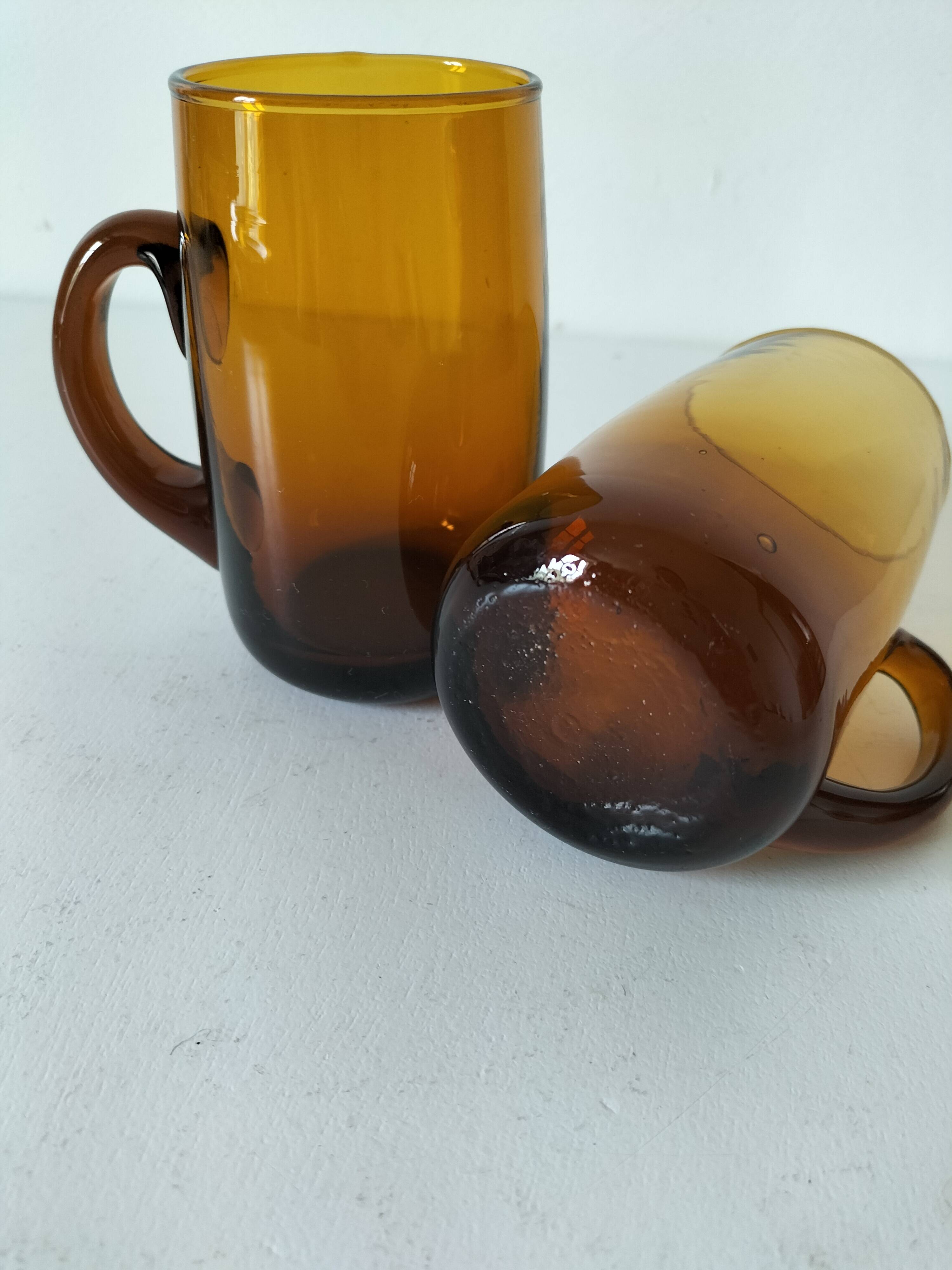 Pair of vintage amber glass tankards