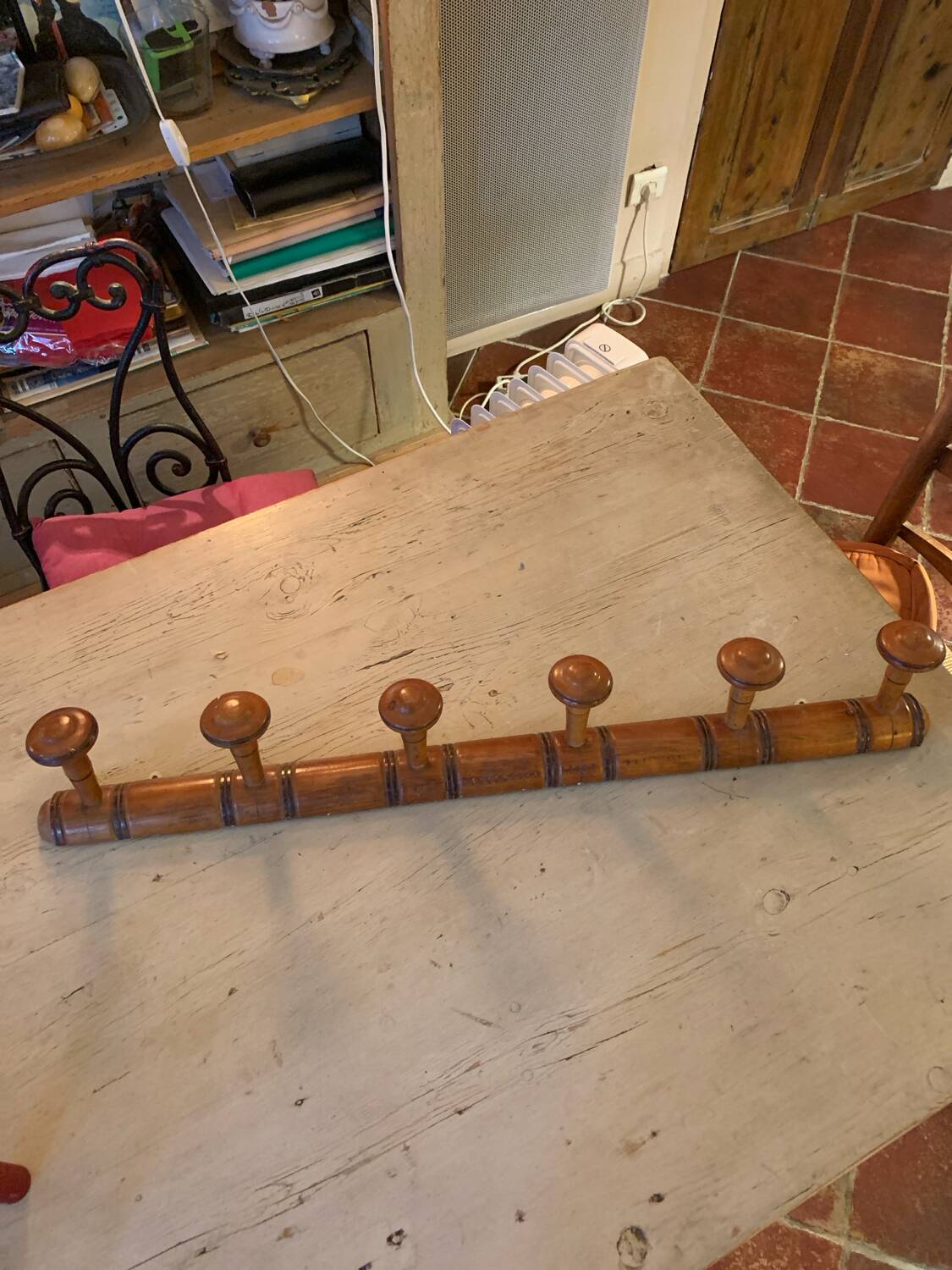 Coat rack with six wooden hooks