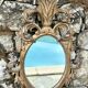 Miroir en bois doré sculpté .