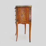 Baroque style wooden chest of drawers with bronze frieze.