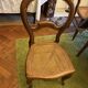 Light medallion chairs and carved fruit chairs.