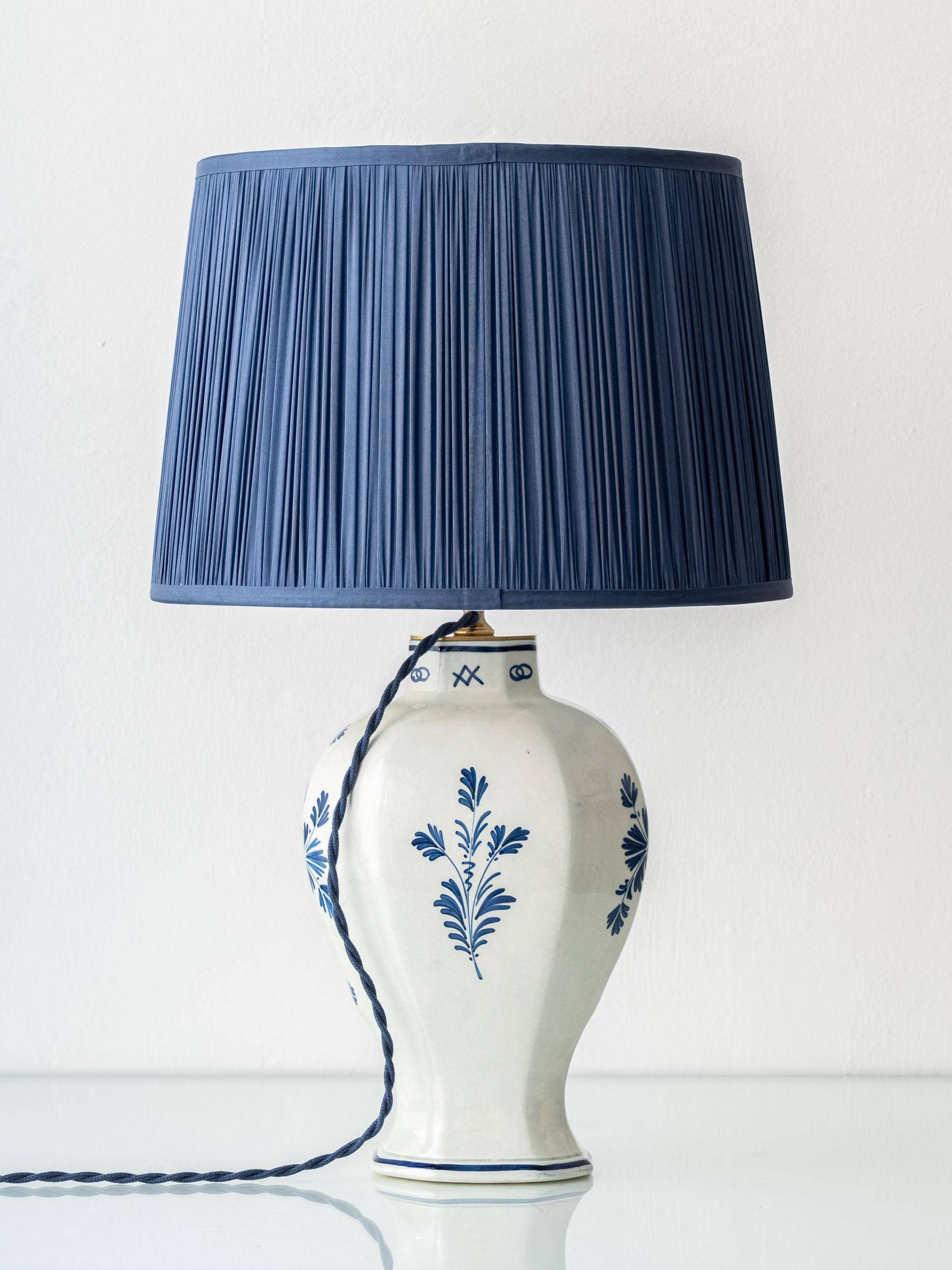 Pair of Royal Delft blue and white ceramic table lamps, 1905, with new pleated silk shades.