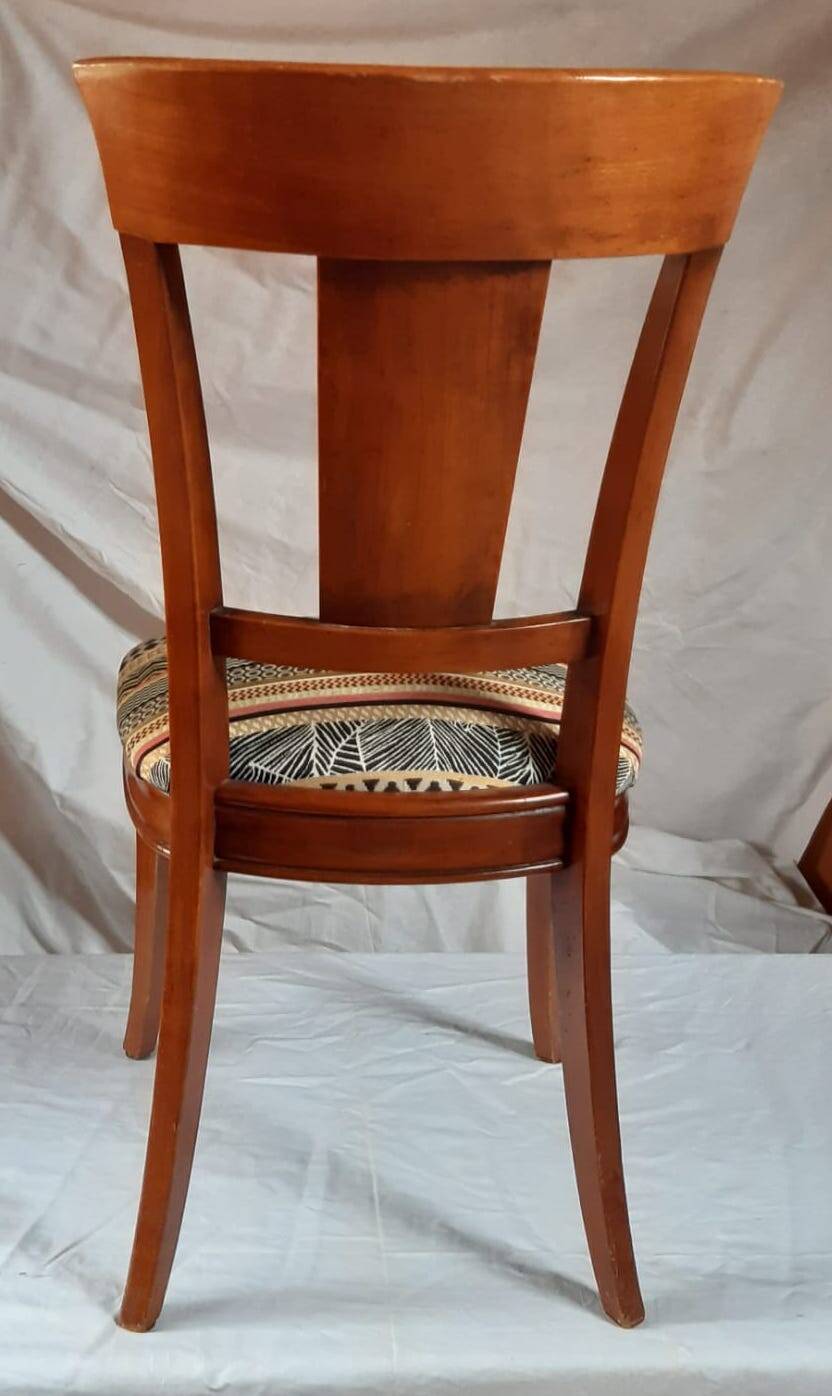 2 varnished solid wood chairs with "ethnic" padding