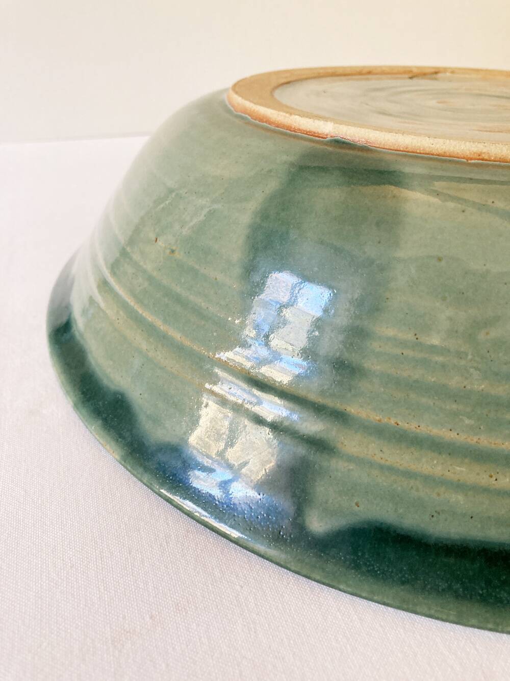 Celadon green stoneware dish signed