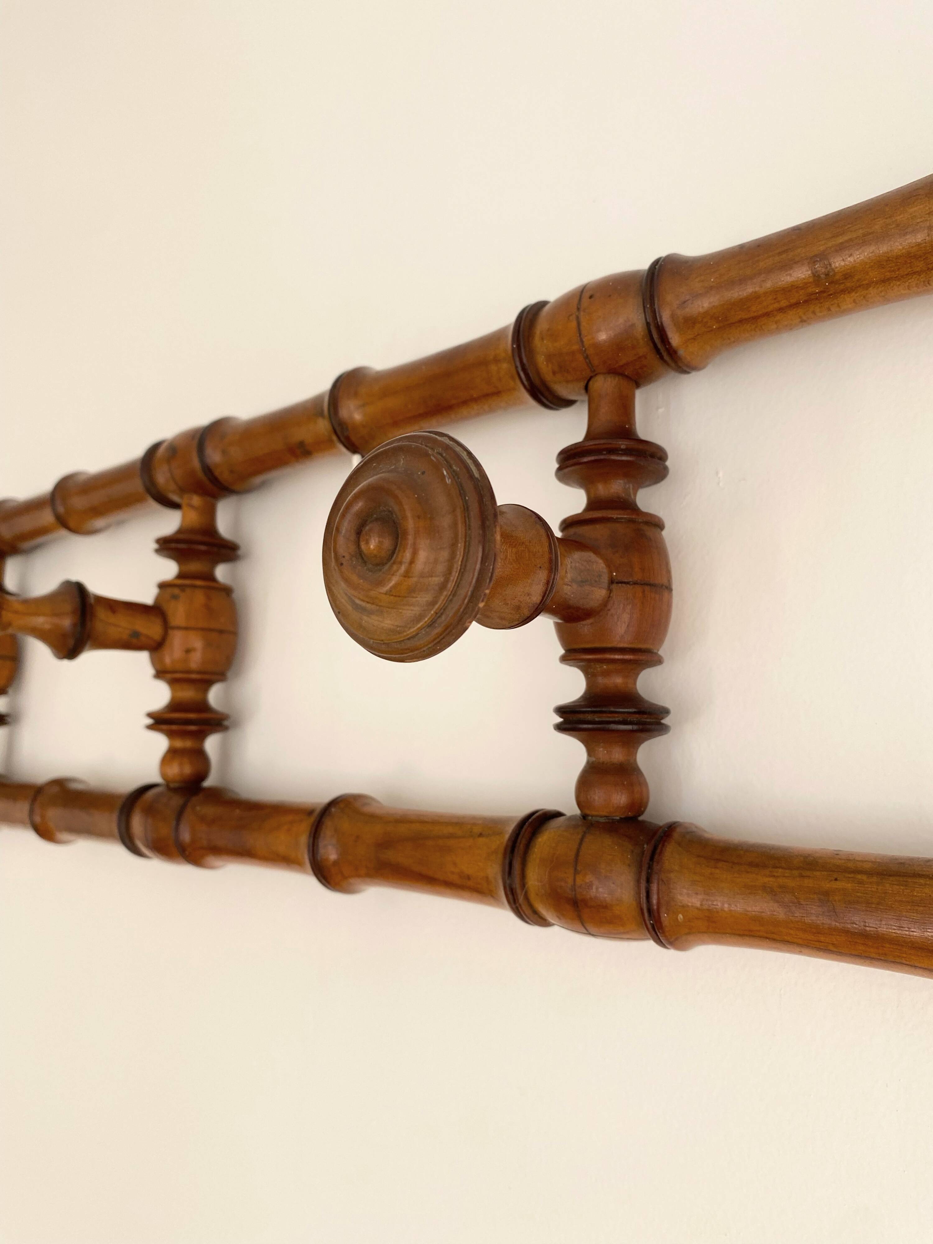 Vintage wooden wall coat rack with 4 swivel hooks from 1920