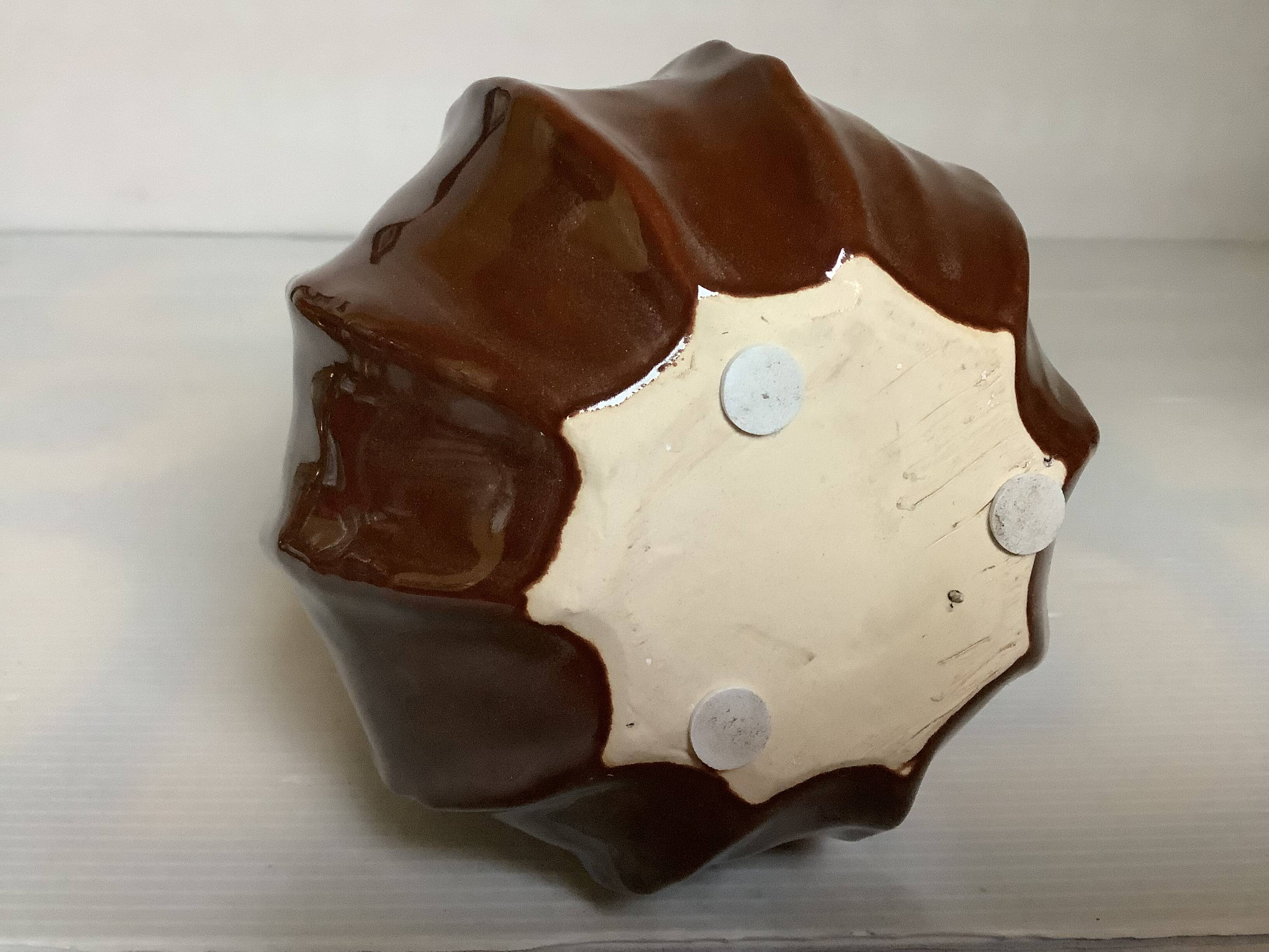 Brown ceramic corolla vase