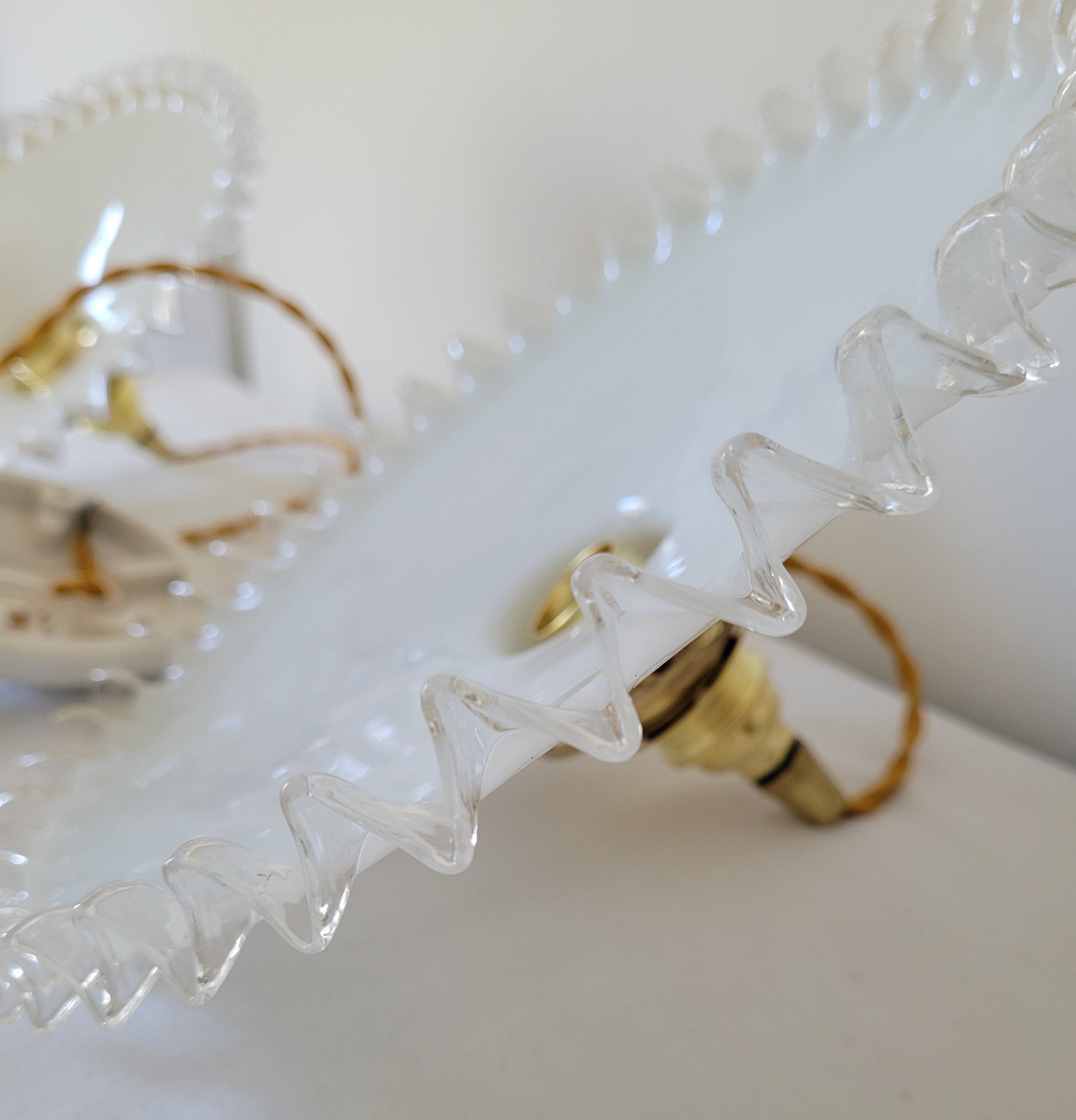 Duo of serrated opaline suspensions