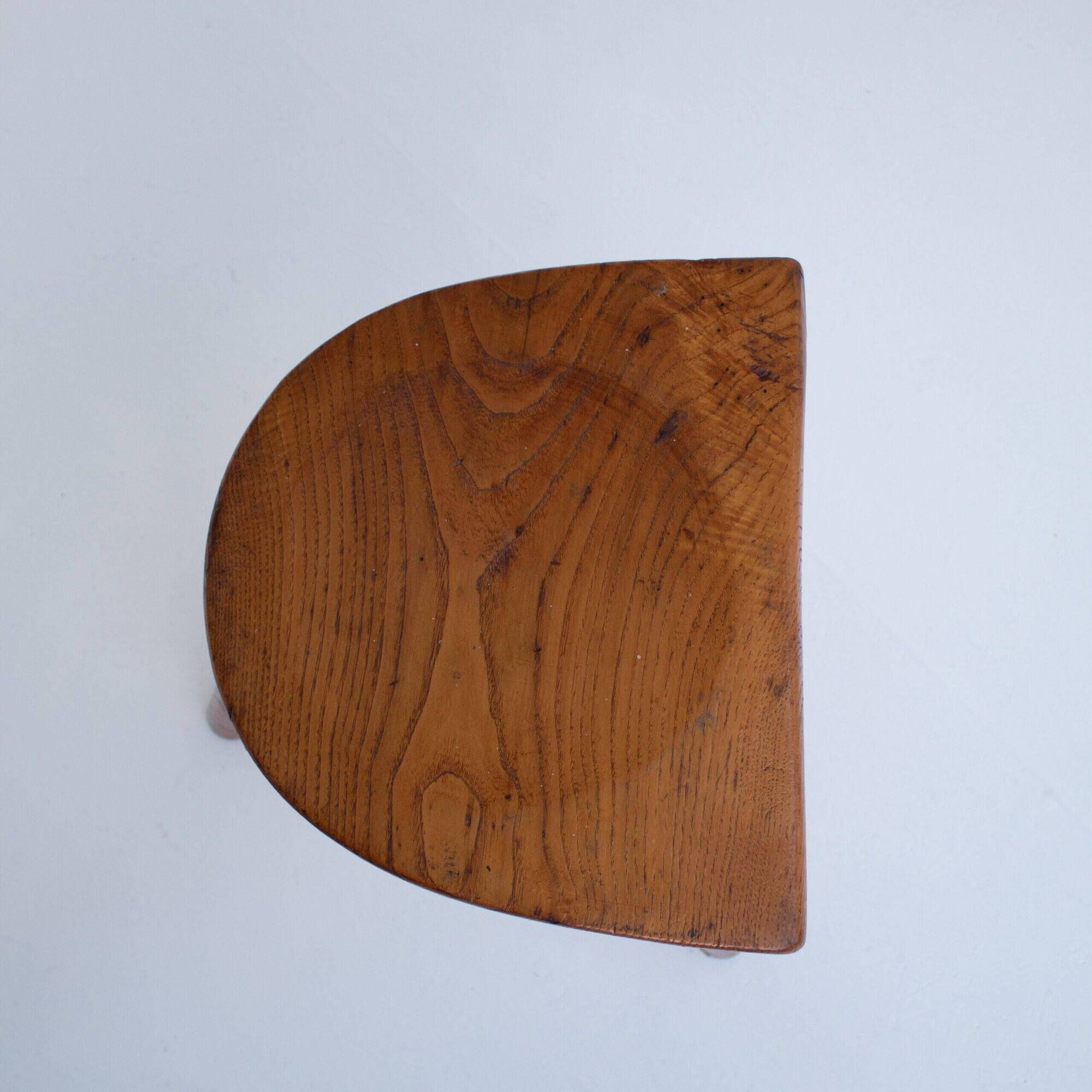 Set of two hand-carved wooden stools with sculpted seats