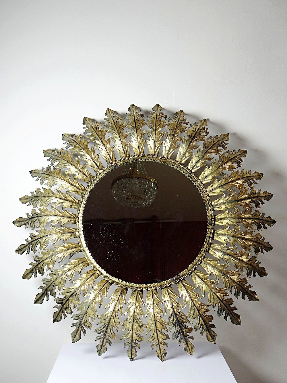 Large Italian sunburst wall mirror in gilded metal, 1960s-70s.