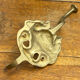 Wall-mounted brass hook