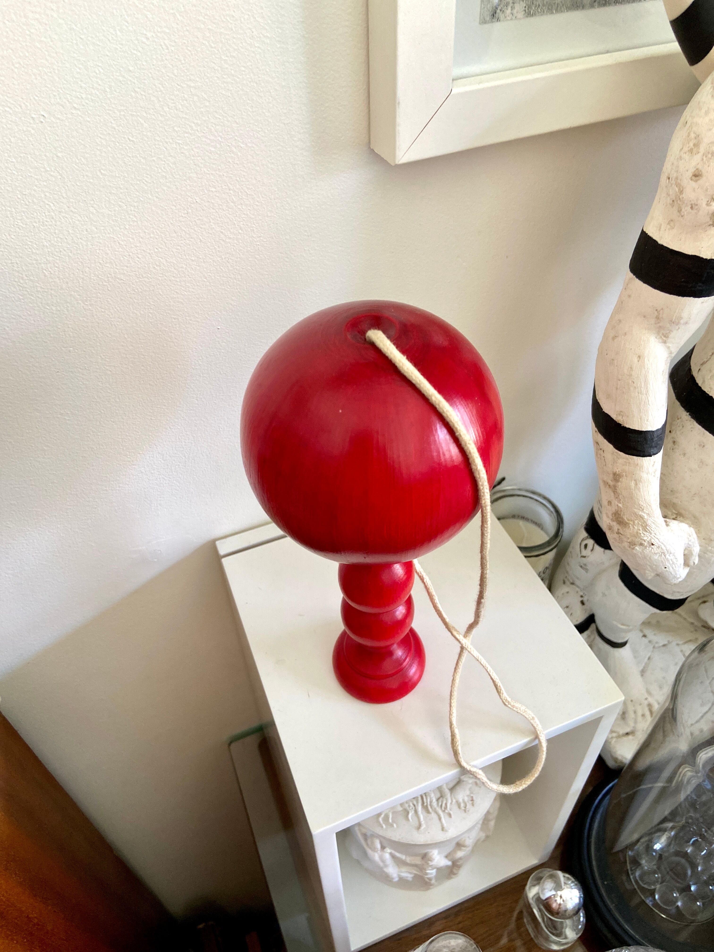 Bilboquet in red wood