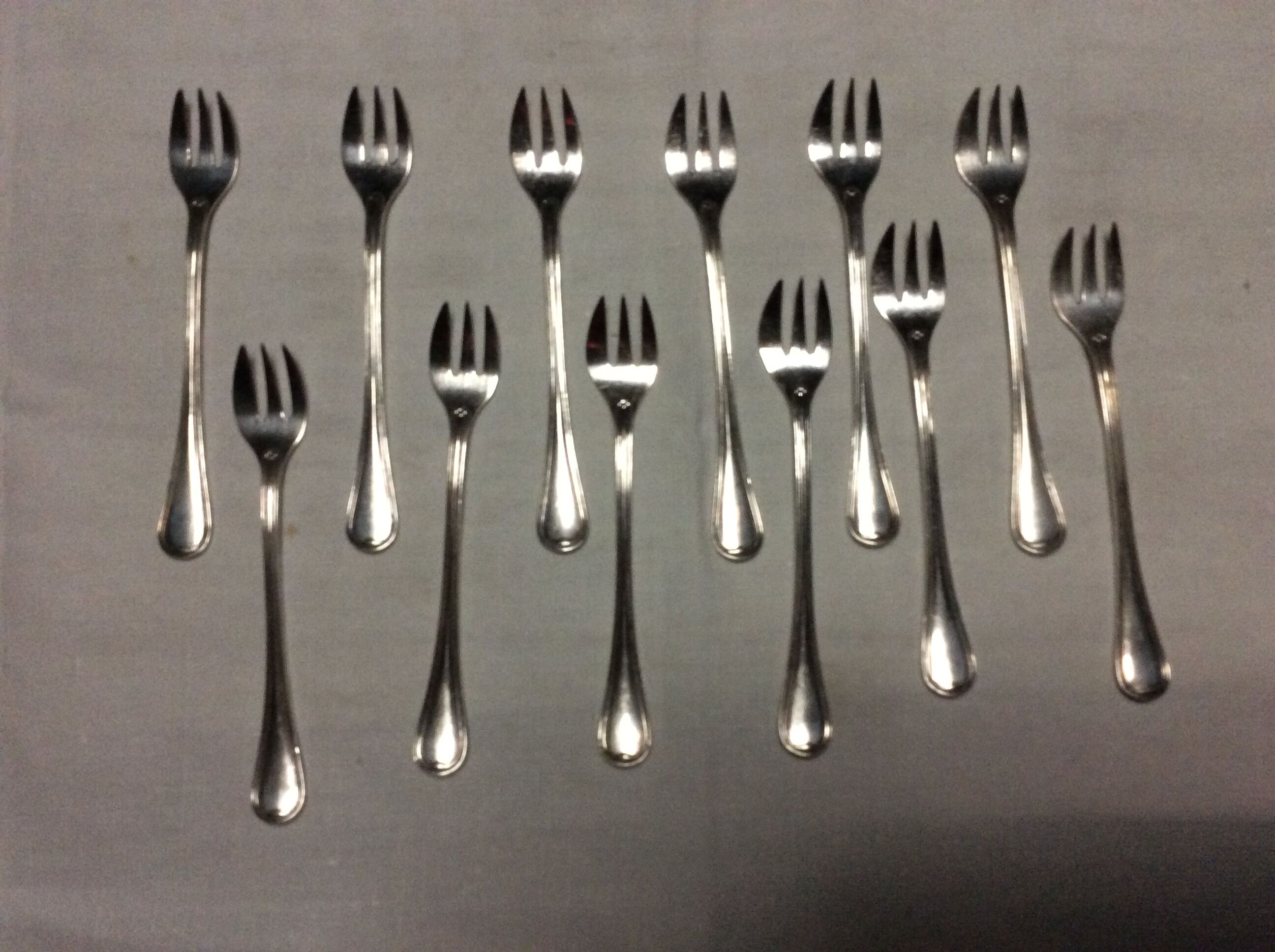 12 Christofle oyster forks in silver metal