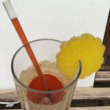 Vintage 80s cocktail lamp in colored glass with a straw and a slice