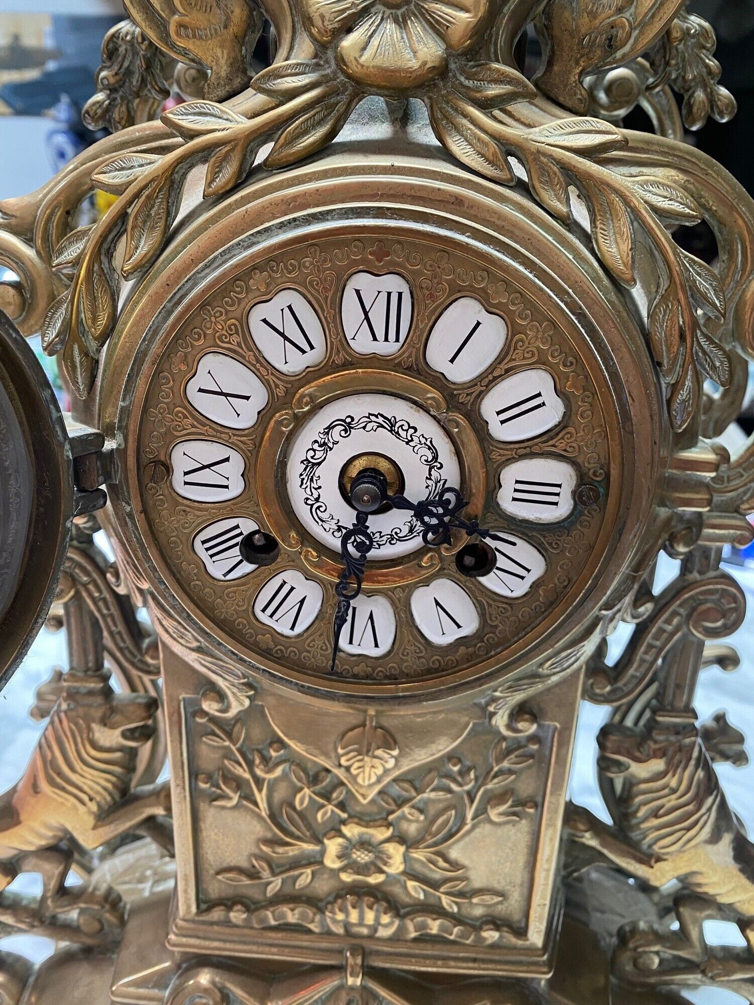 Fireplace trim clock and adornment of antique bronze candelabra