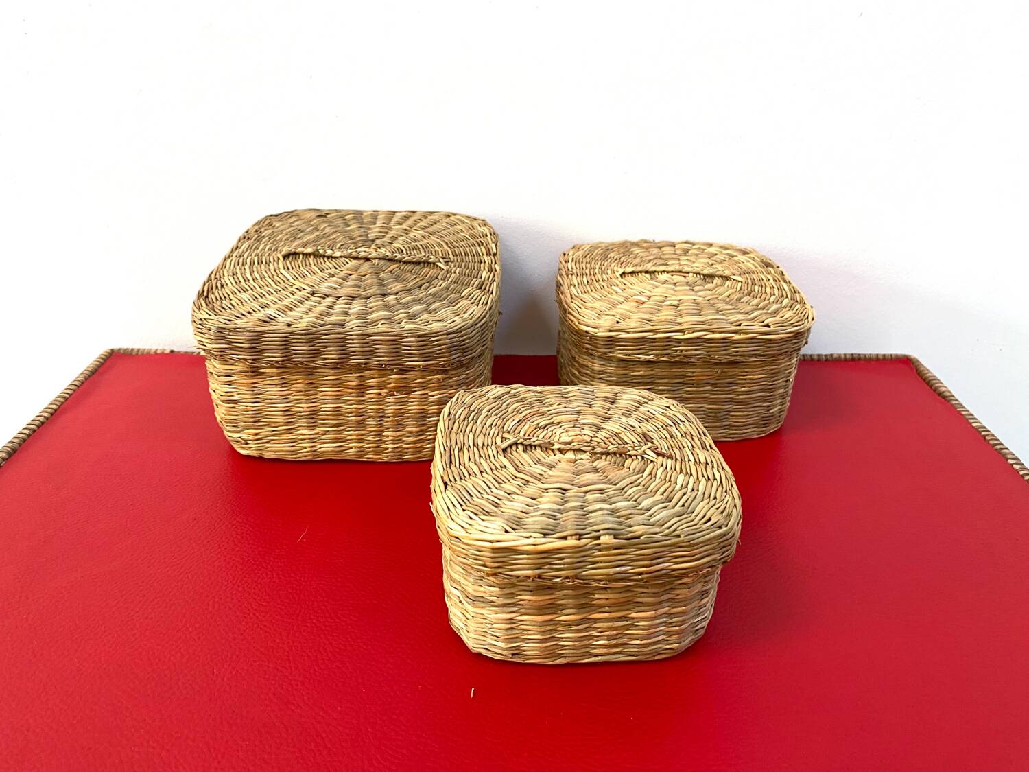 Vintage trio of small rattan nesting baskets