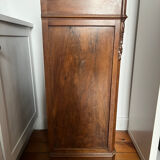 Solid wood storage furniture with a marble top.