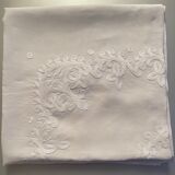 White hand-embroidered square tablecloth at stem stitch