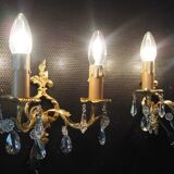 Pair of gilded bronze sconces and crystal pendants