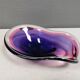 Beautiful dish/bowl in many coloured glass.