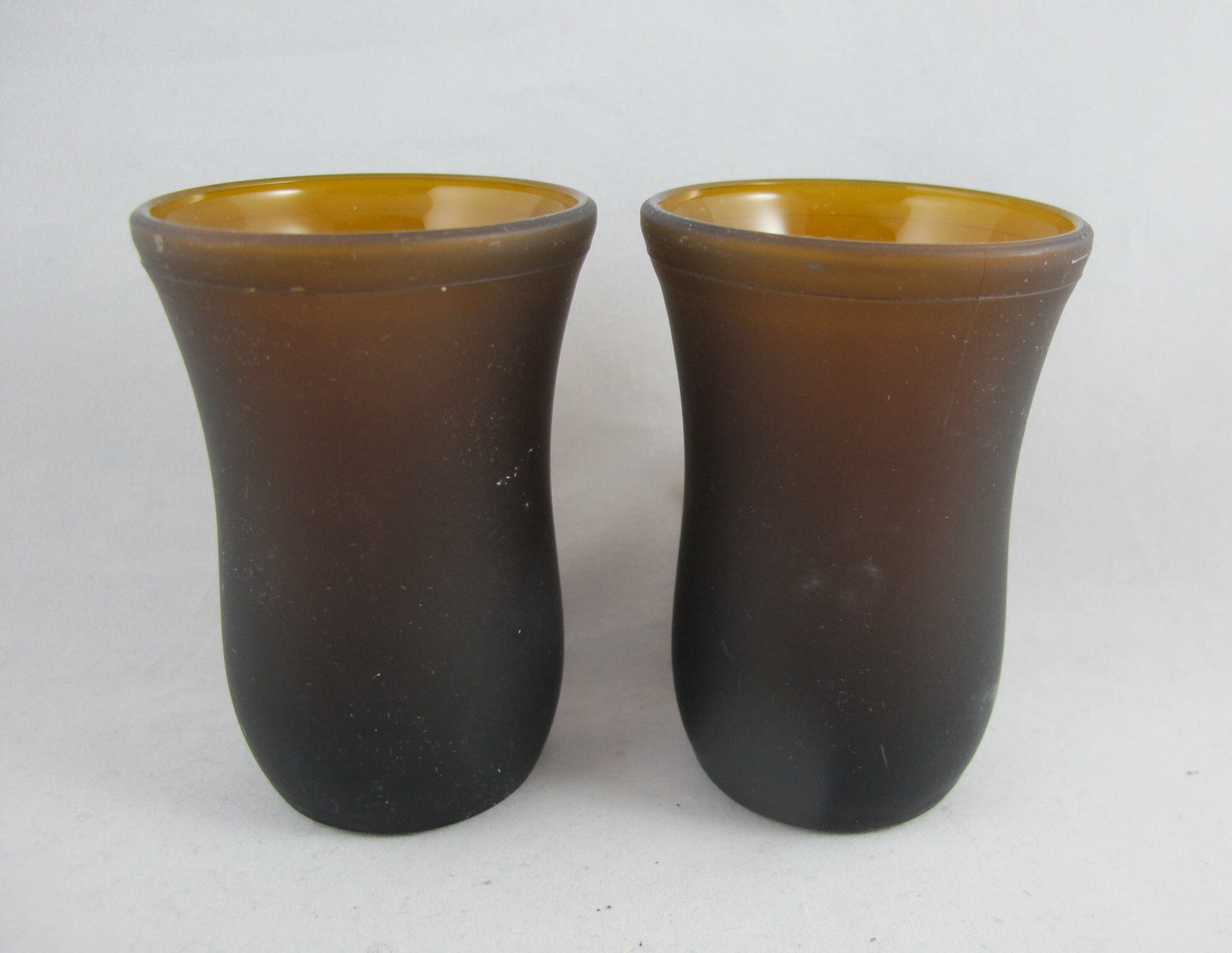 pair of small brown glass cups