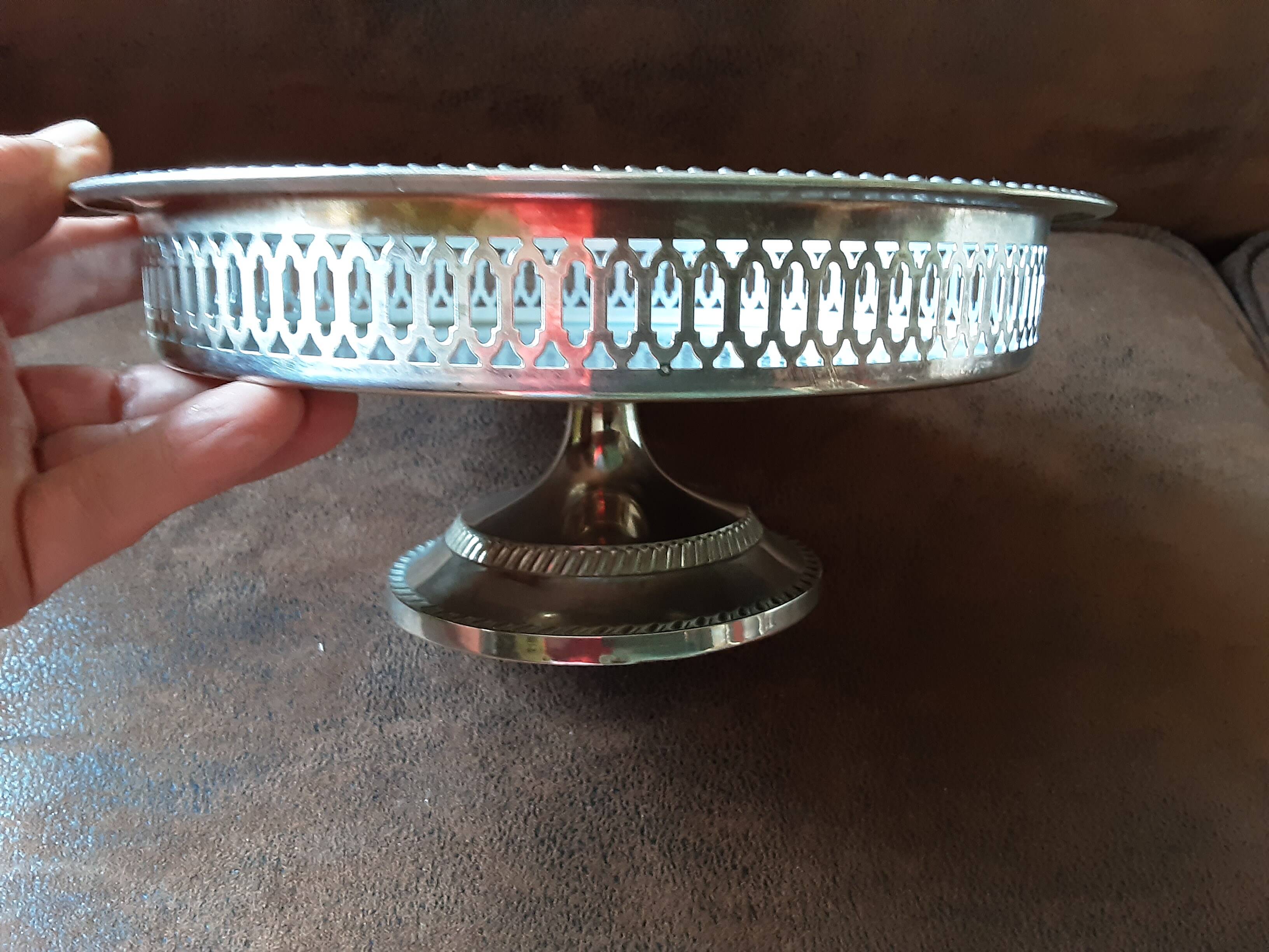 Old metal bowl on foot