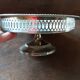 Old metal bowl on foot