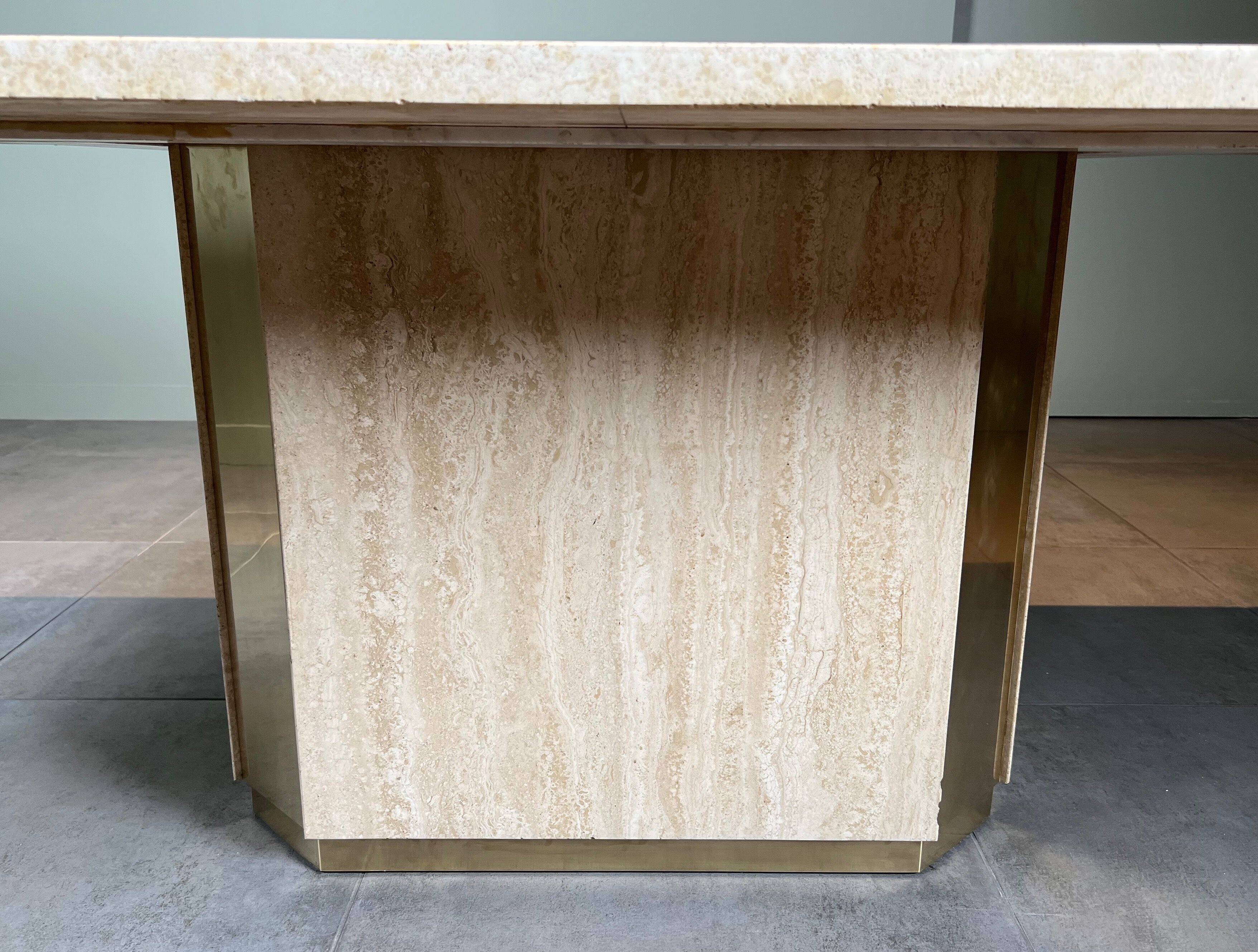 Dining table in travertine and brass. French work. Around 1970.