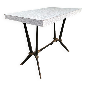 Vintage bistro table with an Art Deco style cast iron base and Formica top.