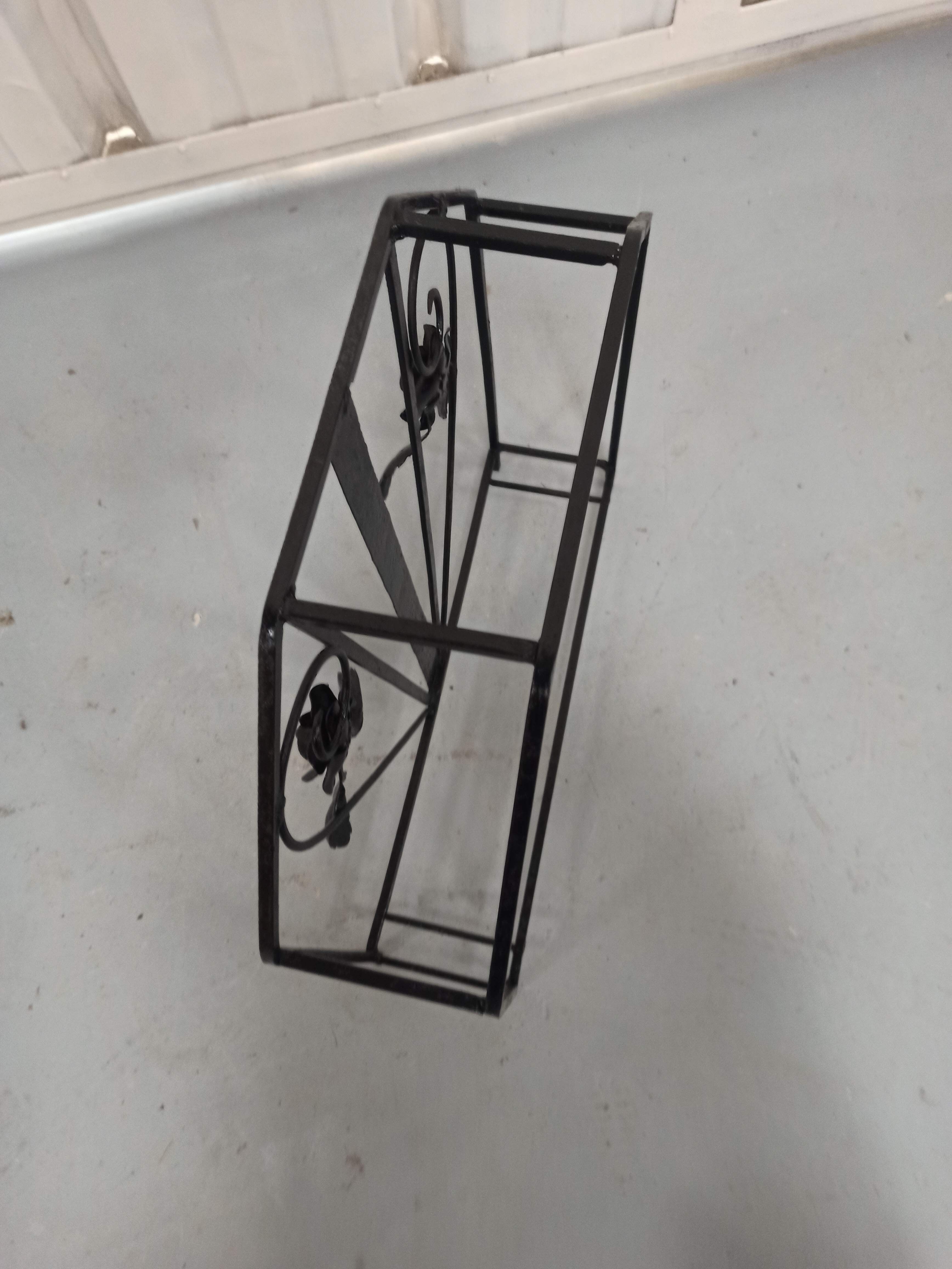 Pink-decorated iron umbrella door.