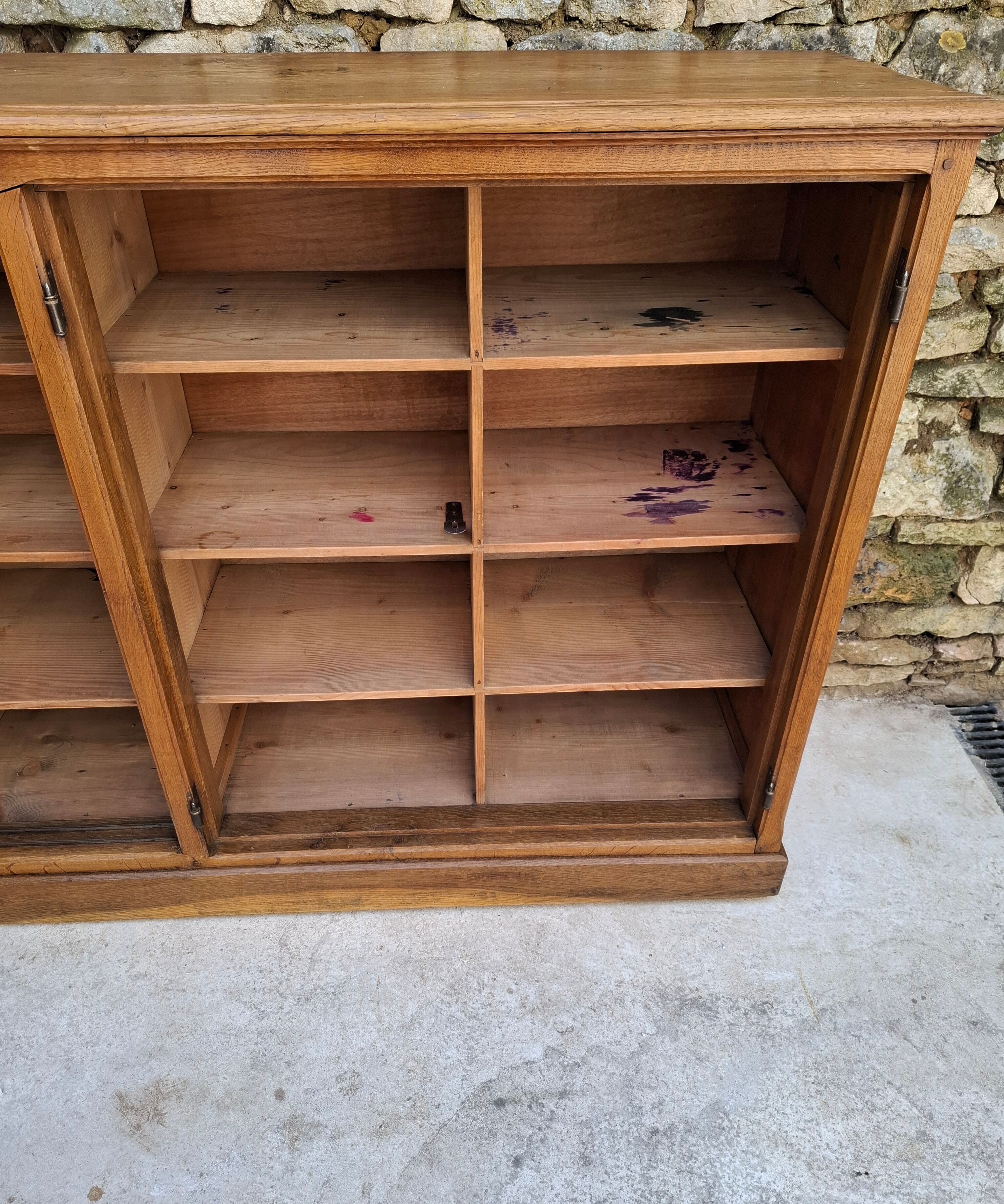 Oak workshop furniture with sliding doors.