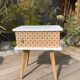 Beautiful vintage bedside table with tapered legs, Scandinavian/pop style in raw white.