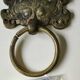 Ancient door knocker, taotié mask, shang dynasty. in bronze golden patina