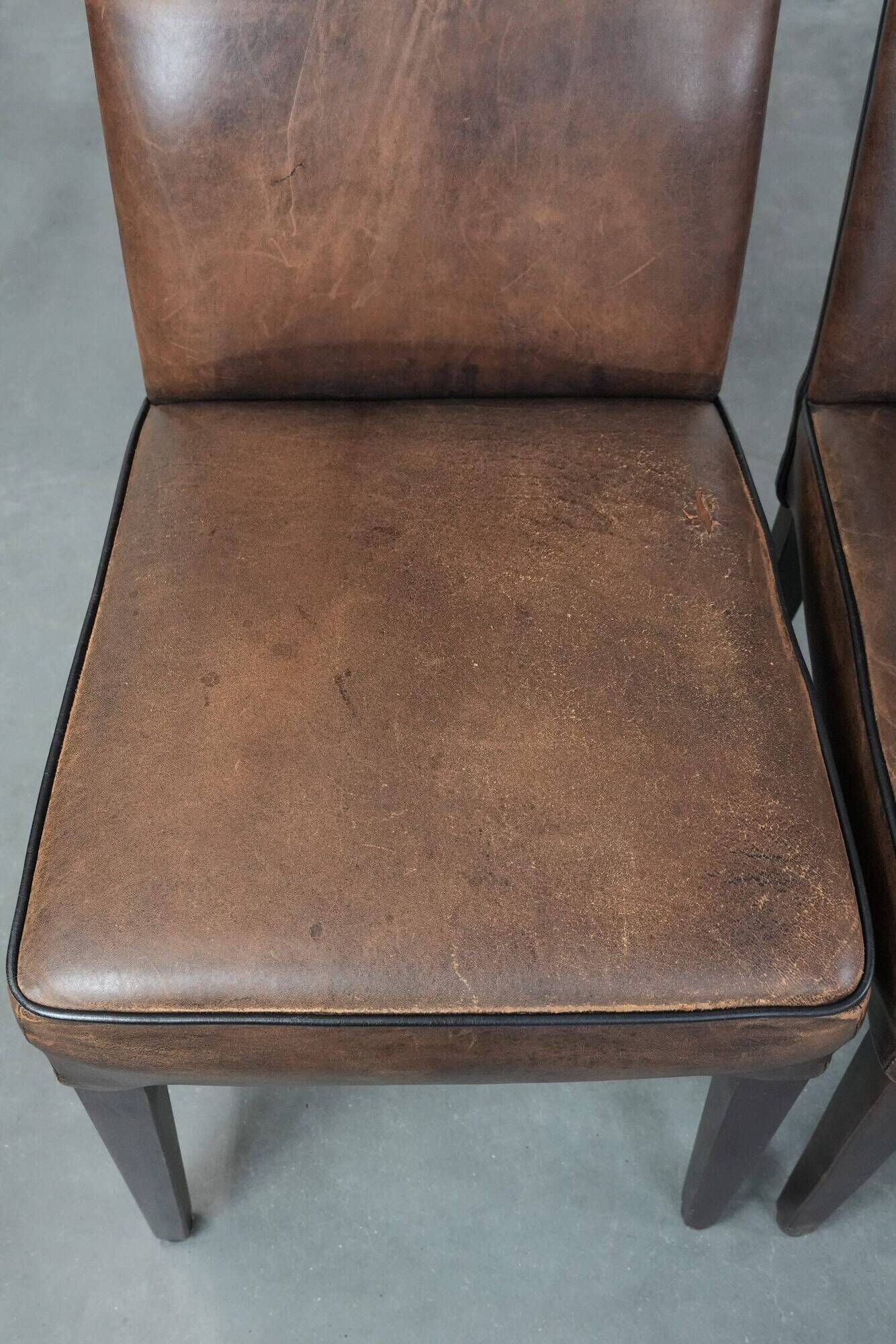 Set of 6 vintage sheepskin dining chairs finished with black piping