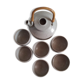 Set of sandstone teapot with rattan handle and six bowls from the 70s