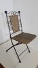 Vintage folding wrought iron and rattan chair
