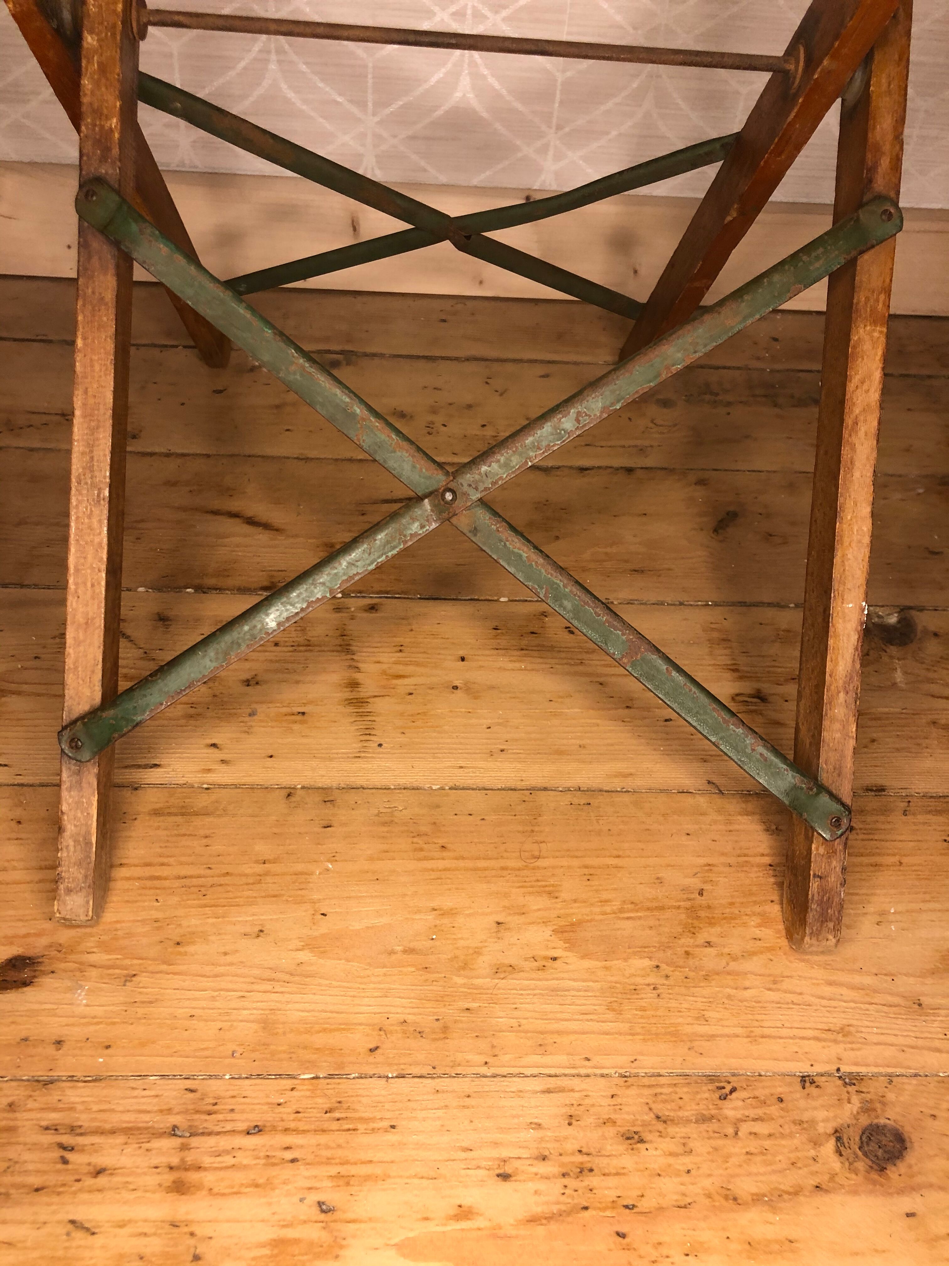 Wooden and iron slatting stool